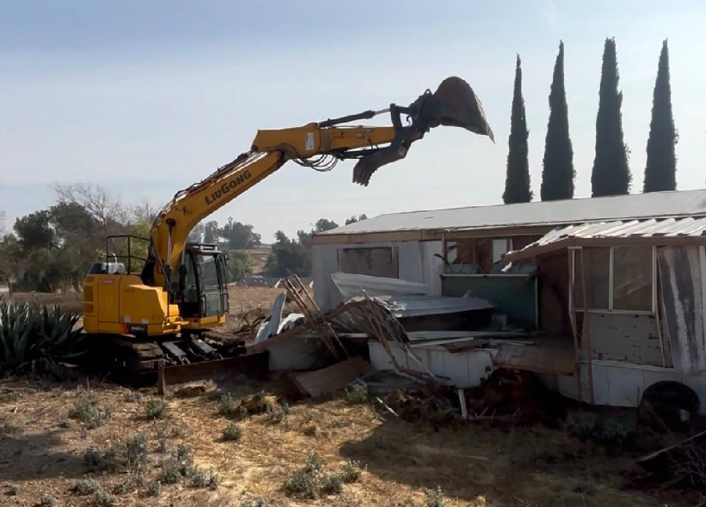 Yellow excavator at construction site
